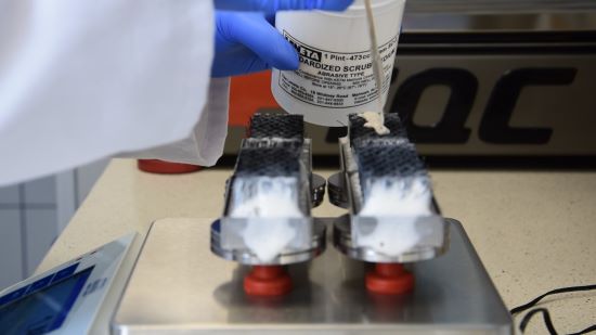 Figure 2. ASTM D2486 brushes during subsequent weighing of scrub medium between 400 cycles.jpg