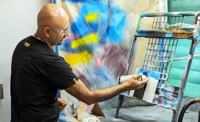 Graffiti artist GONZO247 painting on a canvas in an art studio