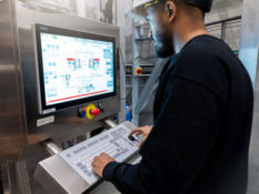 factory worker at computer station