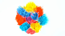 Colored powder explosion on white background