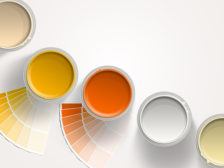 Five paint cans - yellow, orange, white with paint samplers on white background