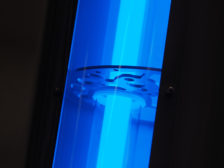 Blue UV light source in an industrial pipe arrangement