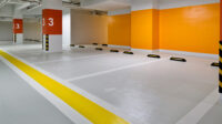 Empty underground parking in modern building with new floor