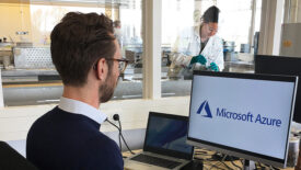 Photo of a man sitting at a computer